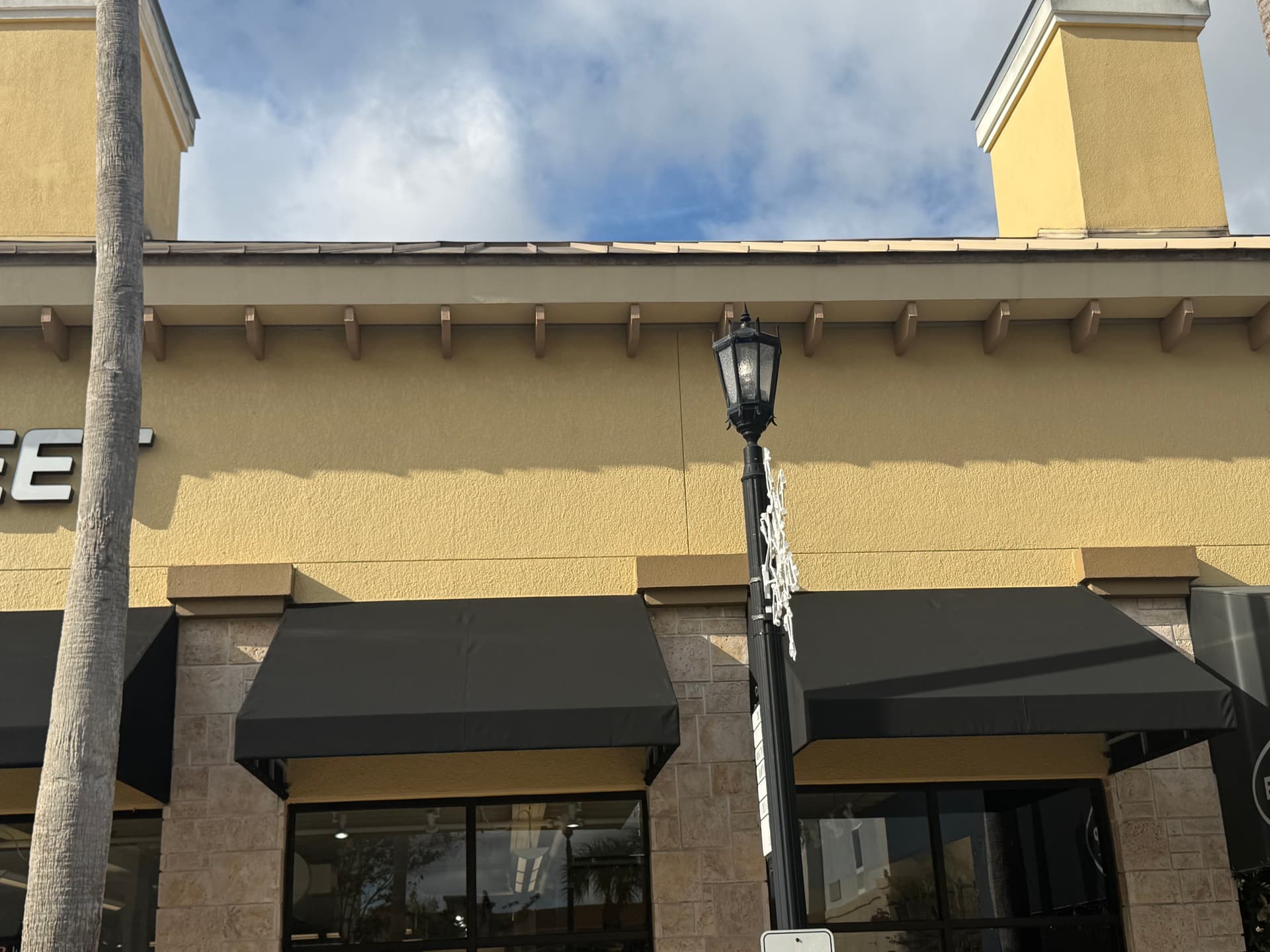 Gallery photos for Black Sunbrella Canvas Awning Recovers for Fleet Feet Lakeland: Image #1