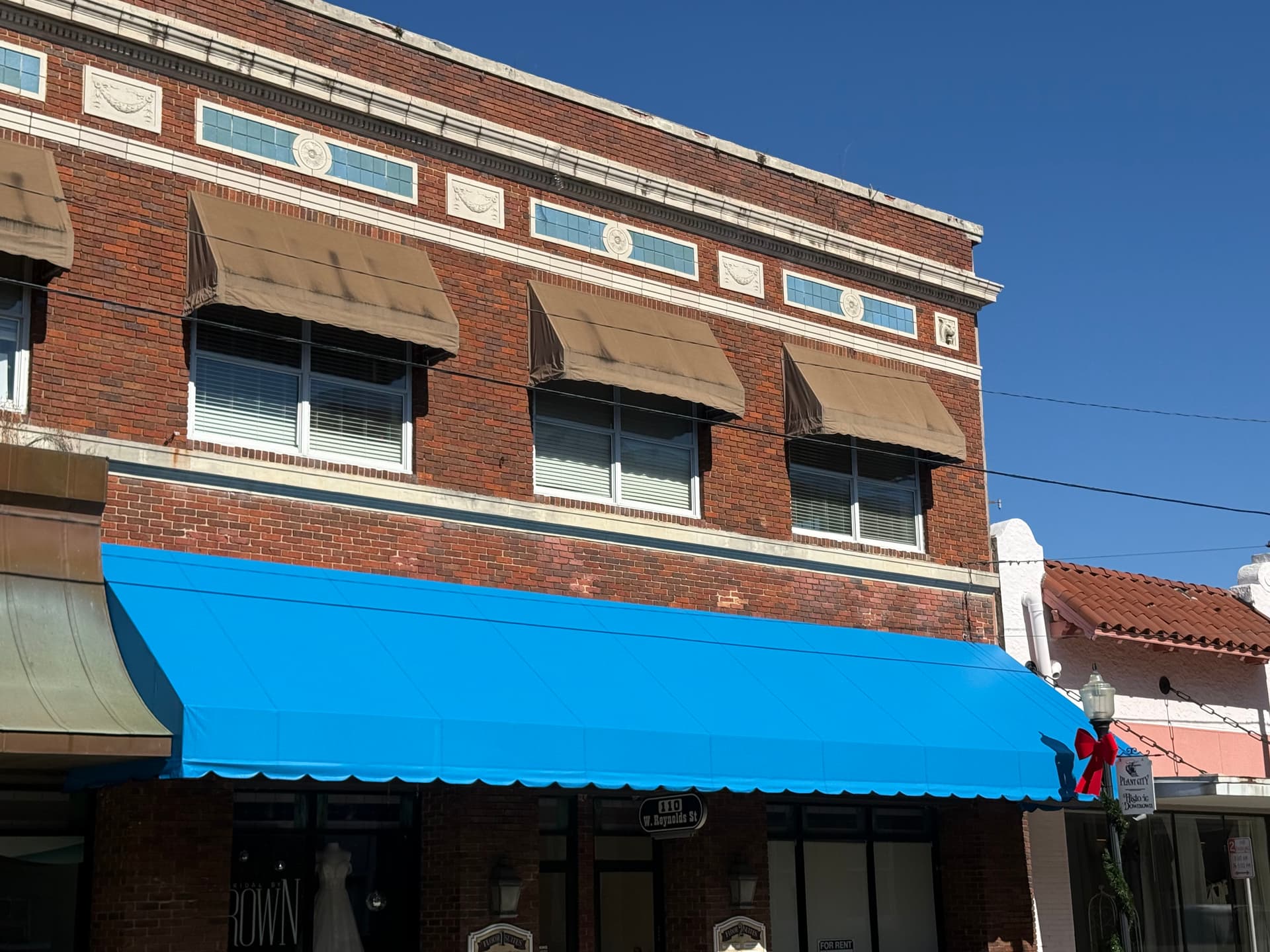 Gallery photos for New Bay Blue Awning Installed on Plant City Brick Storefront: Image #1