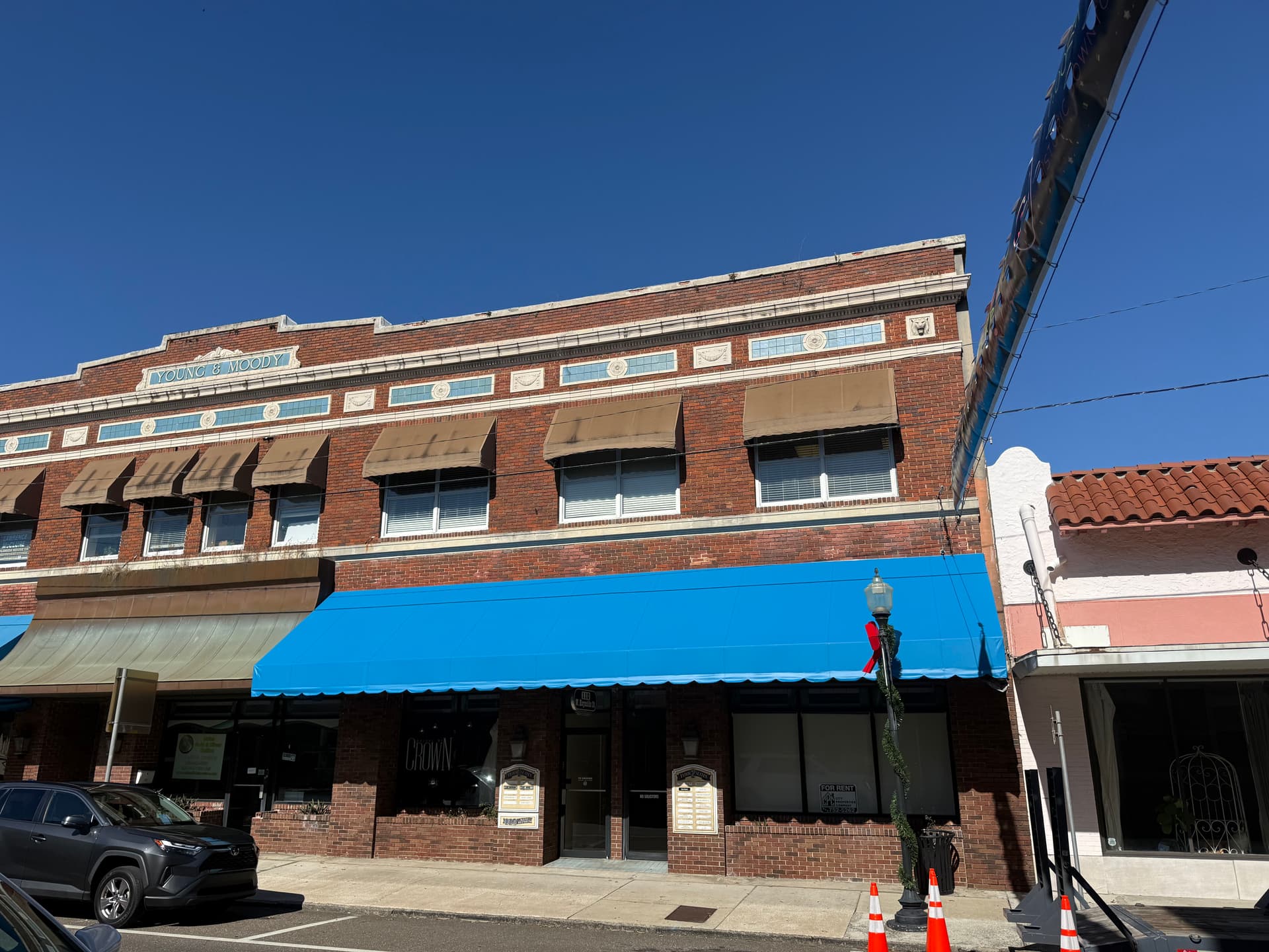New Bay Blue Awning Installed on Plant City Brick Storefront image