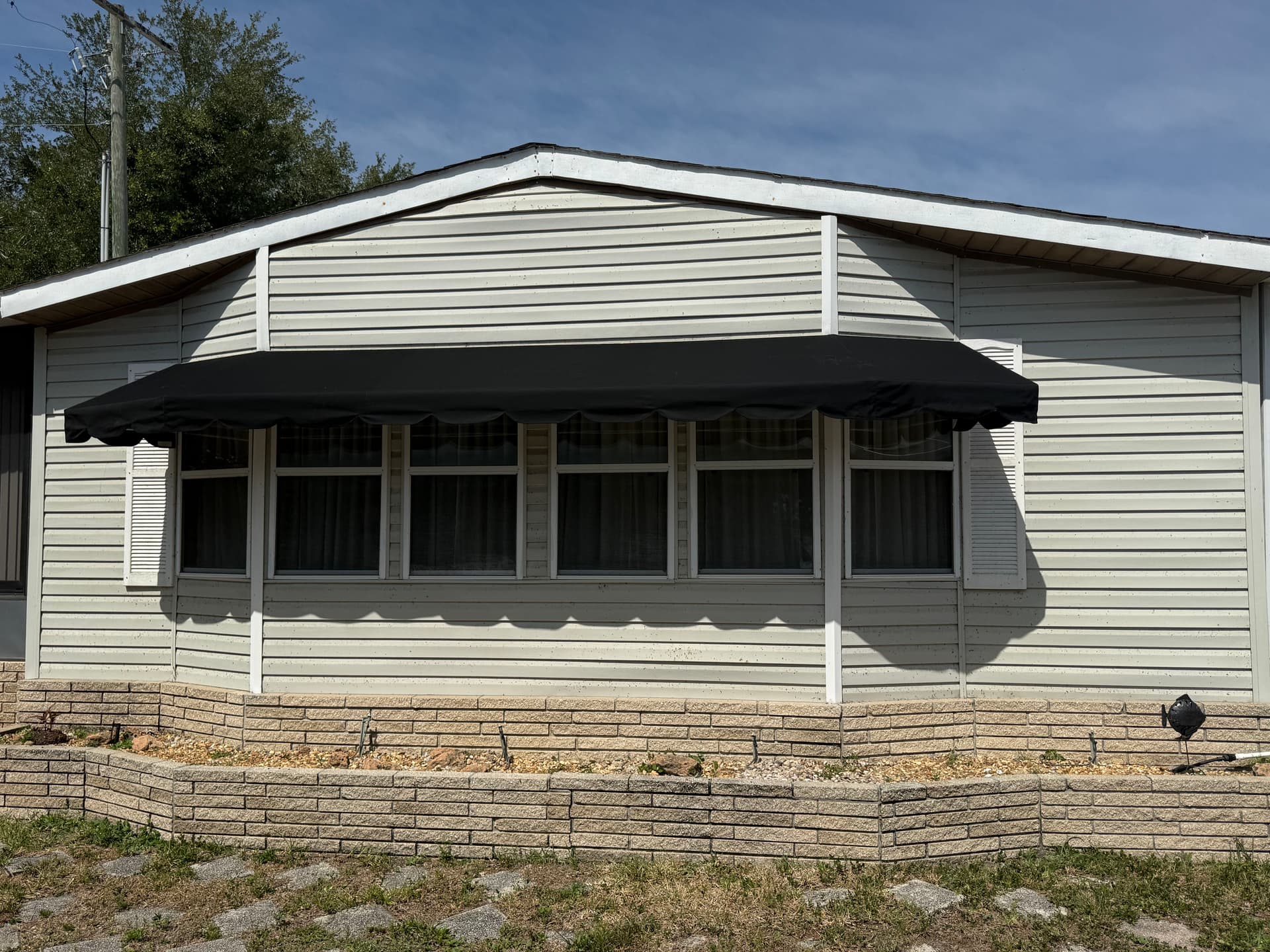 Bay Window Awning Recover in Black Sunbrella in Winter Haven image