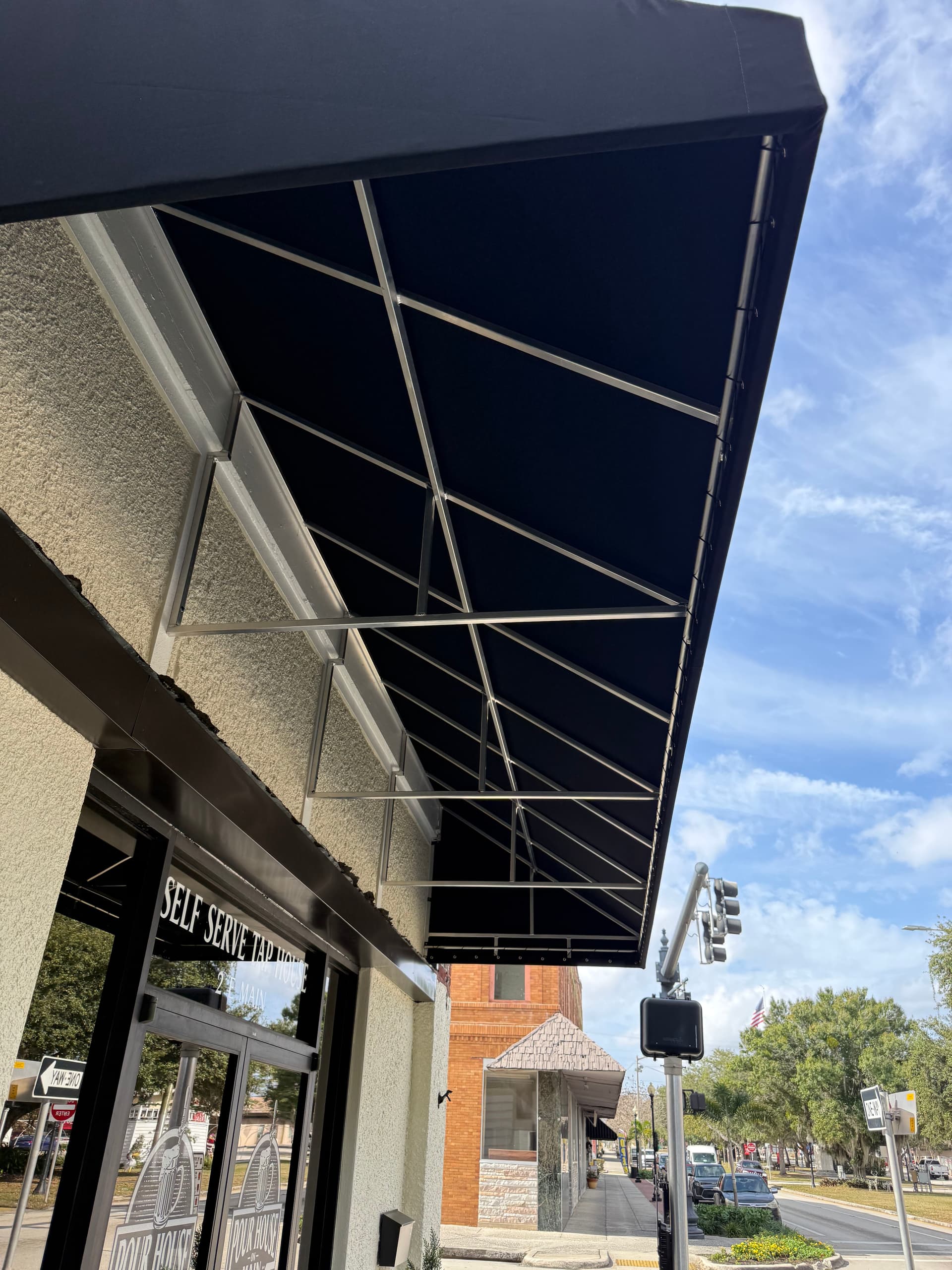 Gallery photos for Bold Black Sunbrella Awnings Upgrade Downtown Avon Park Storefronts: Image #2