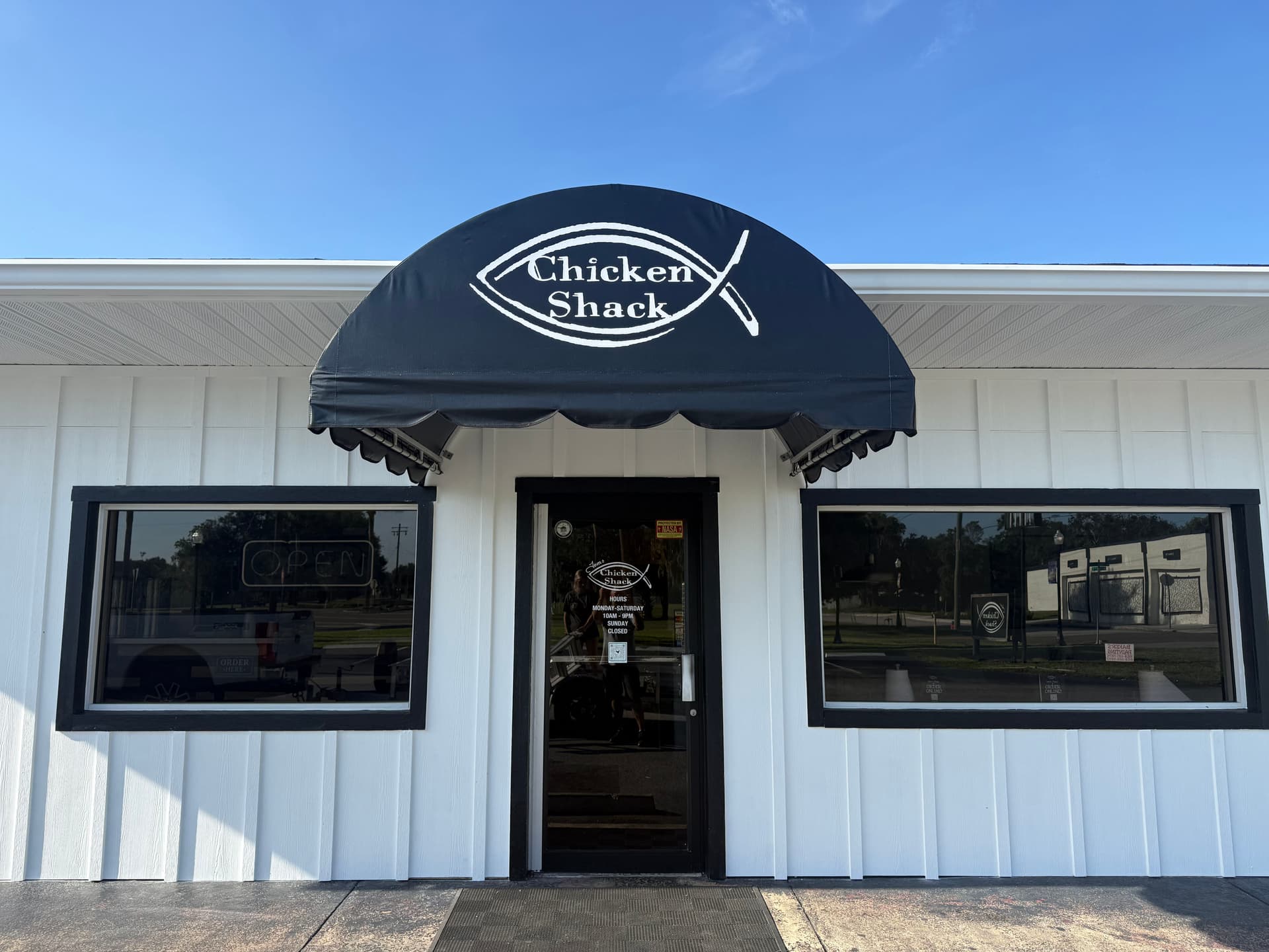 Custom Black Vinyl Awning Install for Chicken Shack image